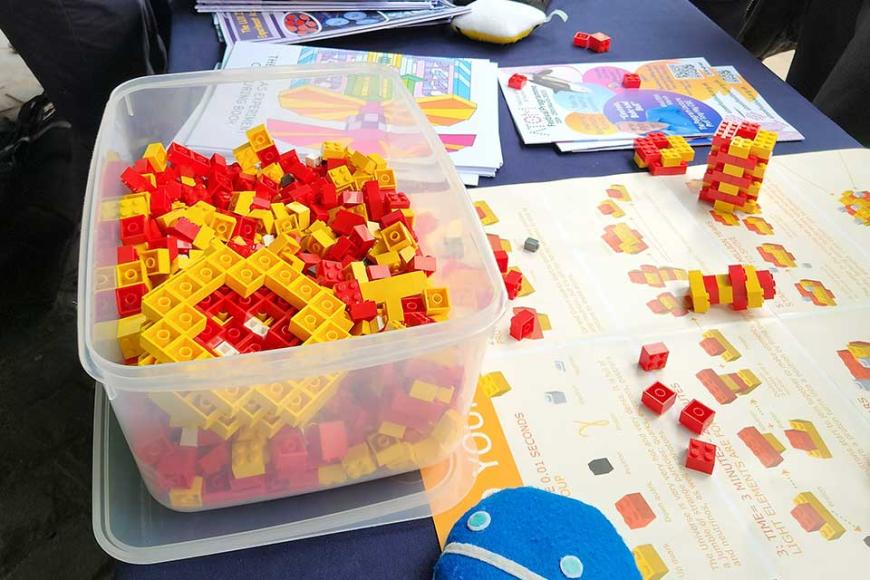 Using plastic bricks to demonstrate up and down quarks