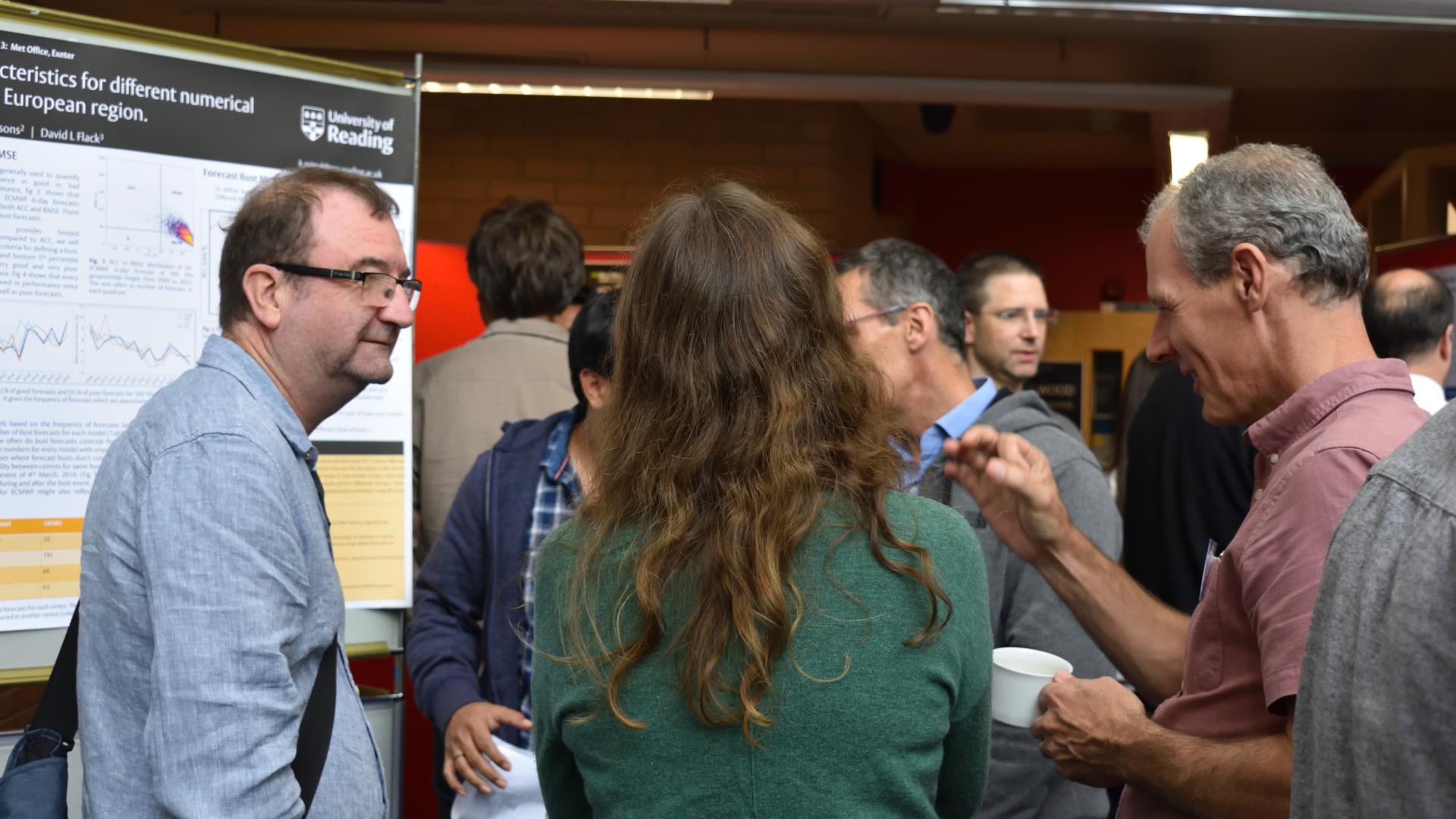 Delegates discussing posters