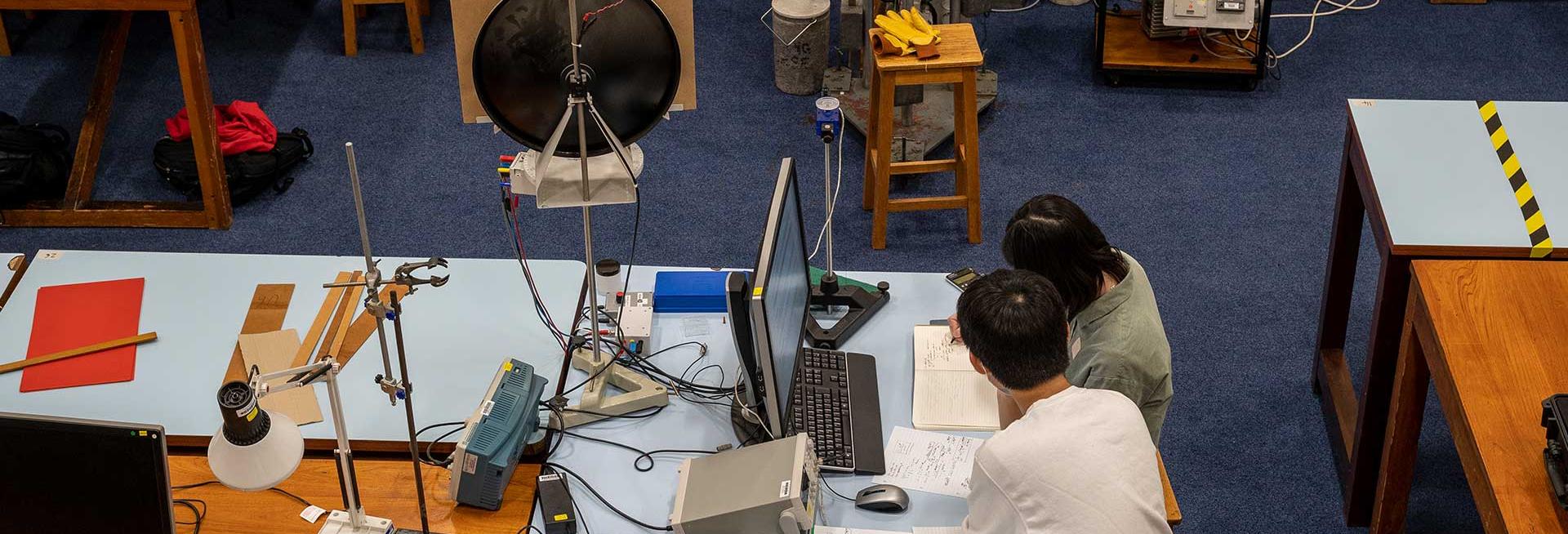 Two students in Department of Physics teaching laboratory